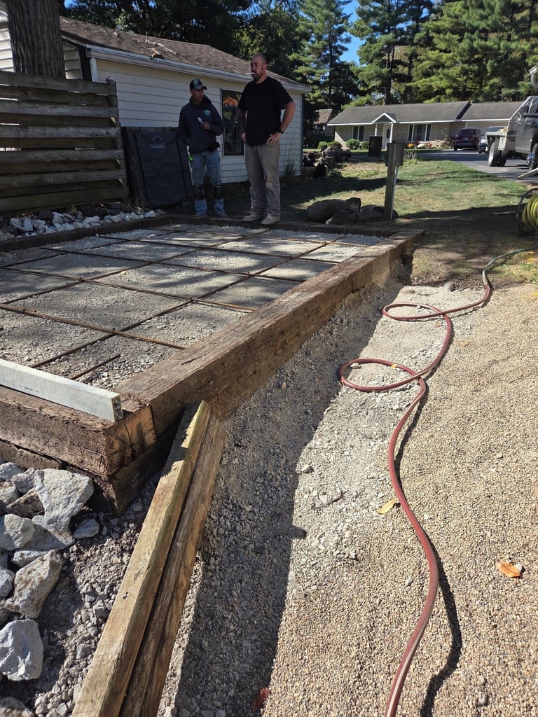 Construction site with concrete foundation and workers
