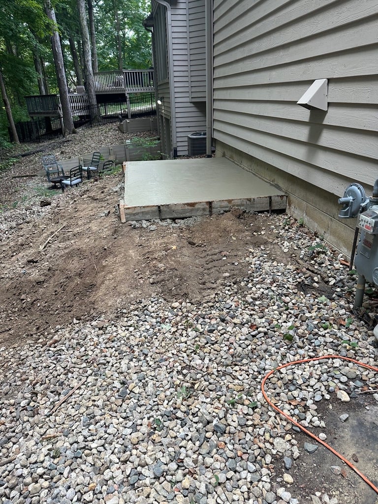 Construction site with concrete foundation and wooden deck
